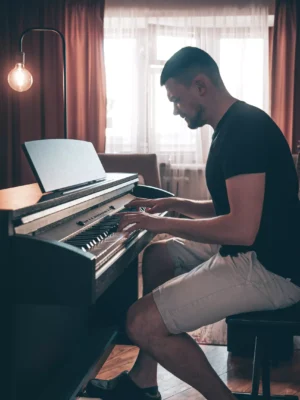 male-musician-plays-the-electronic-piano-in-the-ro-2025-04-01-08-10-00-utc